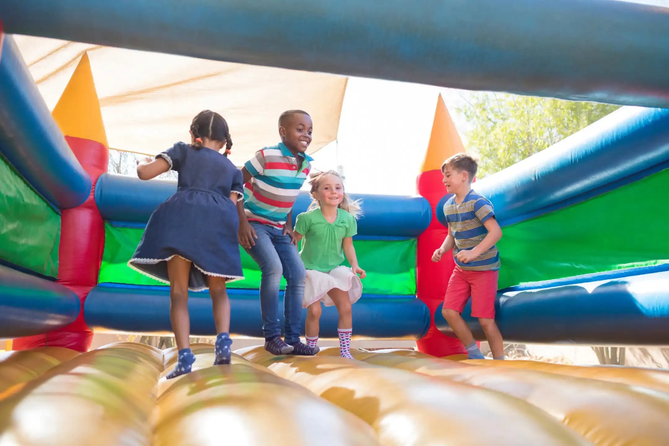 Professional event vendor setting up a bounce house for a kids party in Southern California
